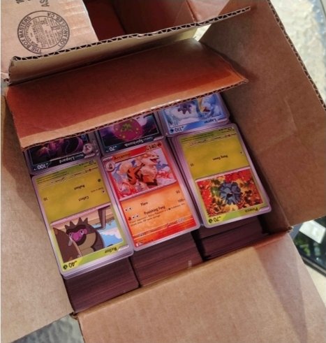 An 8x8x8 box packed tightly with columns of Pokémon cards